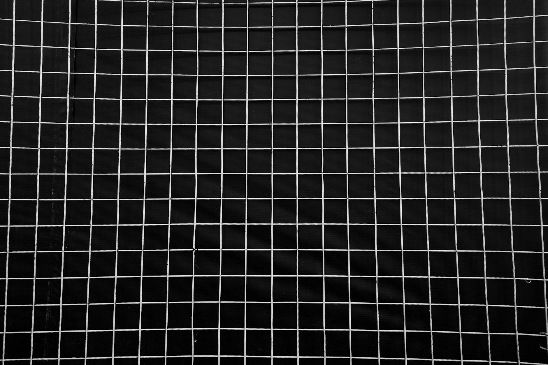 Abstract dark geometric grid pattern background subtle lines